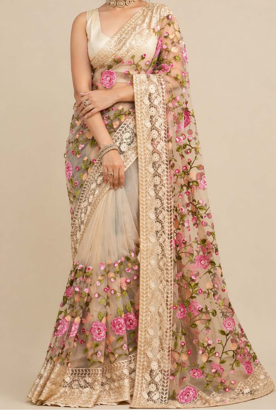 Woman wearing a floral saree with a beige background