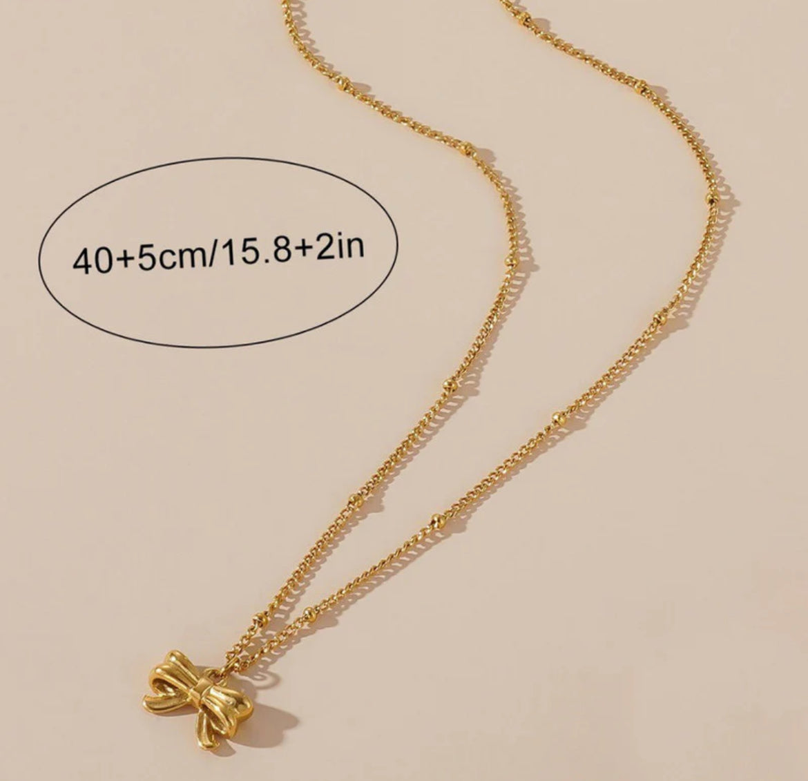 Gold Plated Stainless Steel Anti Tarnish Bow Themed Pendant