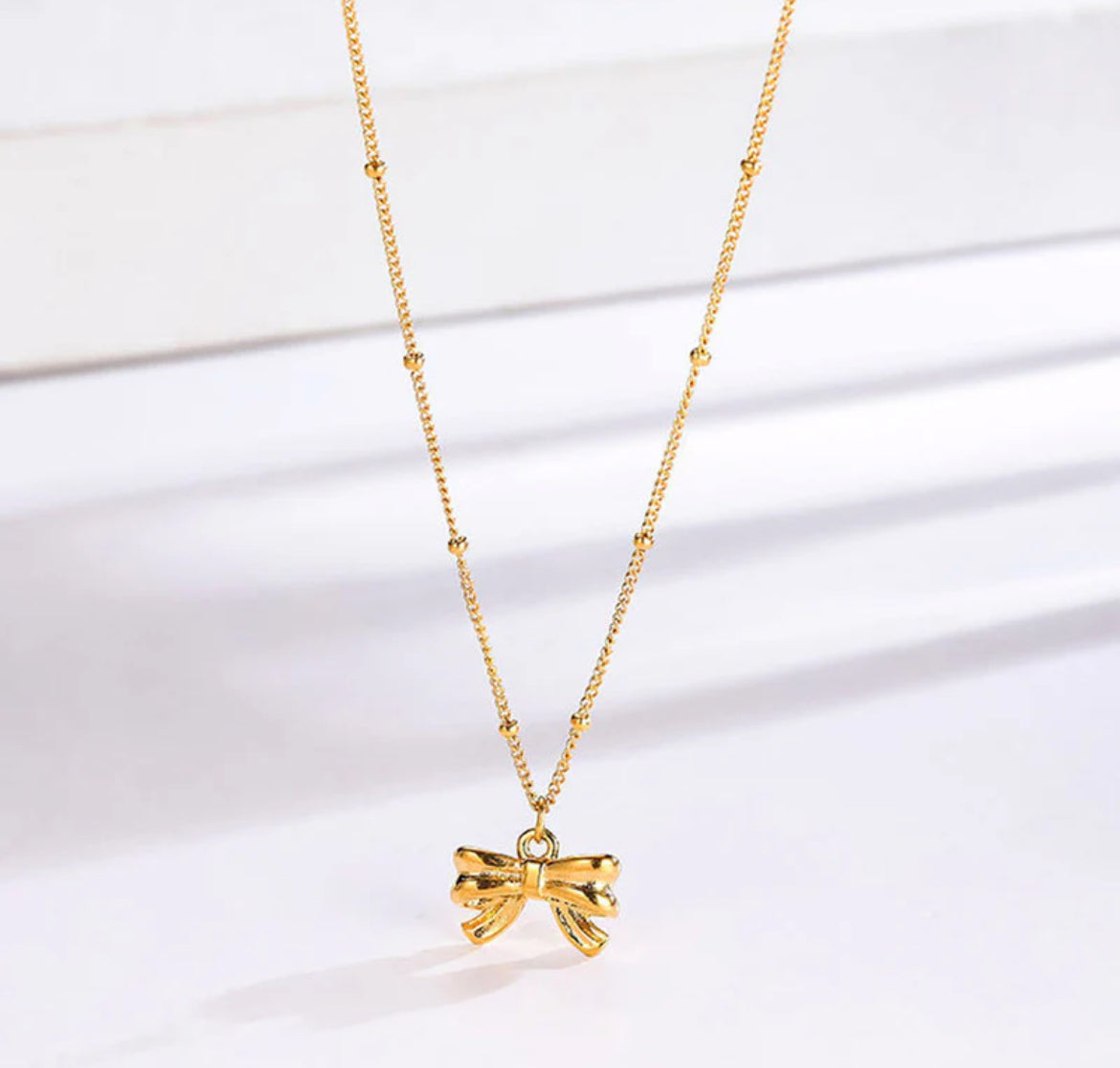 Gold Plated Stainless Steel Anti Tarnish Bow Themed Pendant